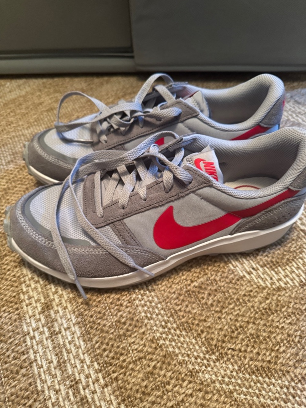 Nike Grey Sneakers with Red Swoosh Accent